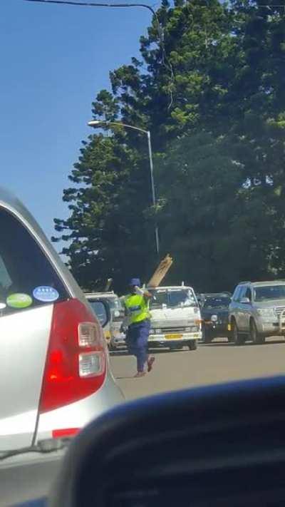 Police officer directing traffic—need this guy's enthusiasm