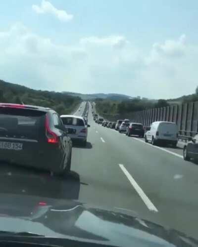 A law in Germany requires all drives on highways to line up to the far side of their lanes during heavy traffic so that emergency vehicles can pass them more easily to reach the scenes of accidents