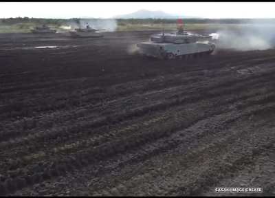 The roar of the 10ZG32WT 2-stroke 1500-horsepower diesel engine on Type 90 tanks of the 2nd Tank Regiment during exercises at the 1st Shimamatsu Tank Range, Hokkaido Island.