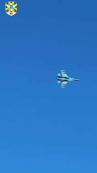 Over the eastern front, a Ukrainian Air Force Su-27 Flanker engages a Russian radar, with its AGM-88 HARM leaping off the rail and climbing into the sky, heading towards an emitting Russian threat. 831st Tactical Aviation Brigade. 