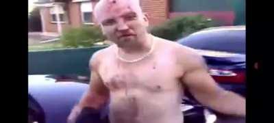 man breaks carwindow with his bald head