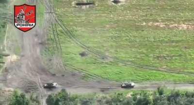 Drone footage of the Ukrainian 65th Separate Mechanized Brigade and 44th Separate Artillery Brigades attacking a Russian tank column in the Zaporizhzhia direction