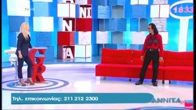 This Greek tv presenter in the presence of this guy who claims to have some serious martial art skills.