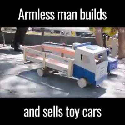 Armless Man (Geraldo Pereira) builds toys with his feet