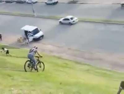 Good samaritan stops cyclist from hitting parked car