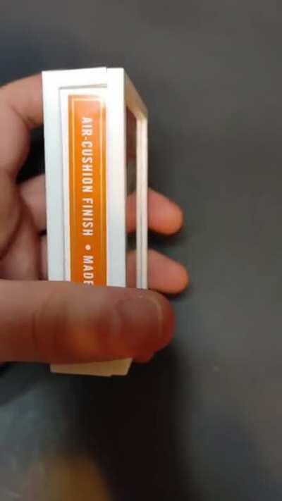 Orange deck of playing cards cut into a 3D design using just an xacto knife. This is the most detailed cut of a deck of playing cards I have done so far.