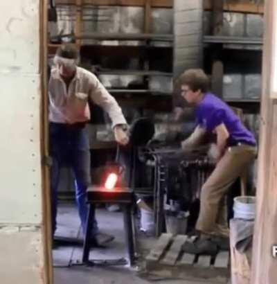 Hammering hot metal