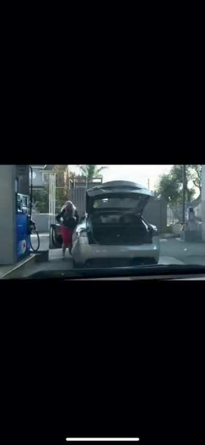 Karen trying to fill Tesla with gas.