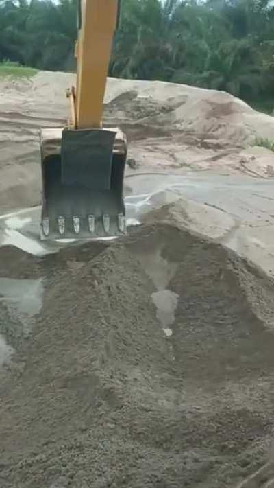 Splashing friend with excavator.