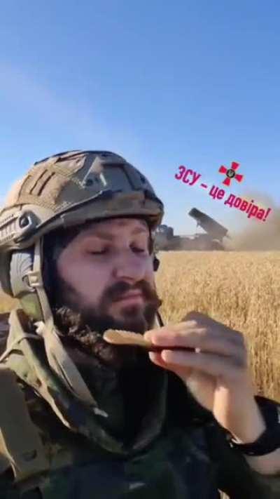 Ukrainian soldier grooms his beard during a MLRS blast off