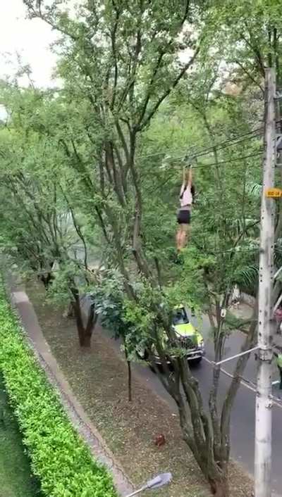 Woman yanking on power lines to get shoes