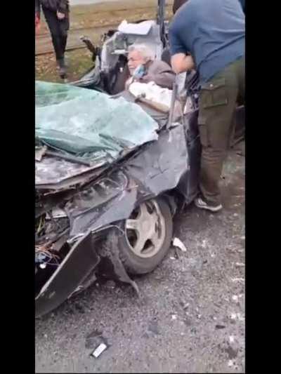 Russian Tank crushing the car + Ukrainians trying to free the old man.