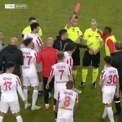 Team manager protects the referees from his own players