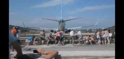 Standing behind a plane