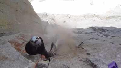 Guy knocks rock off mountain - is 