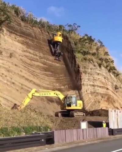 Specialized excavator to excavate off on a cliff