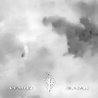 A Russian soldier attempts to hide from a Ukrainian drone under an anti-thermal blanket during daylight (music from the source).