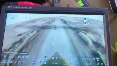 Russian riding on a motorcycle is chased down and struck by an FPV Kamikaze drone