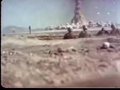 Color footage of atomic bomb tests with active duty military personnel at Camp Desert Rock, Nevada Test Site. Many soldiers who were present were exposed to high levels of radiation, 1950s