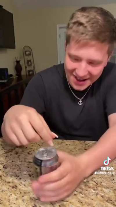 Trying to open a can with fake nails