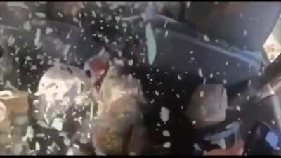 Russian sniper bullet rips through Ukrainian pickup truck.