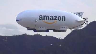 Amazon blimp releasing drones