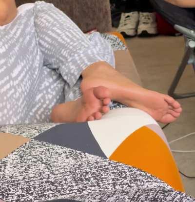 friend's feet on couch