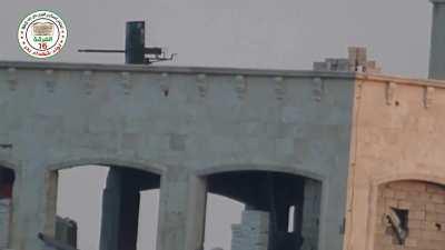 FSA 16th Division &quot;Hell Cannon&quot; team observes an SAA rooftop position before engaging - Aleppo - 6/4/2014