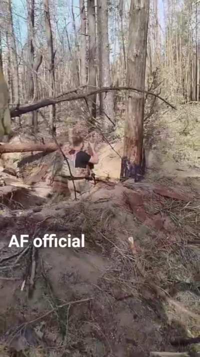 A Ukrainian soldier fires a 120mm mortar round at Russian positions.