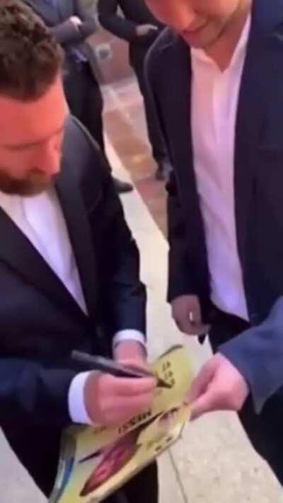 To get Messi's autograph.