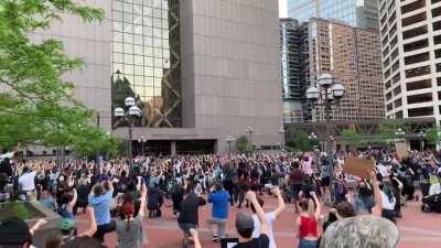 Taking a knee and moment of silence for George Floyd in front of the Hennepin County Government Center