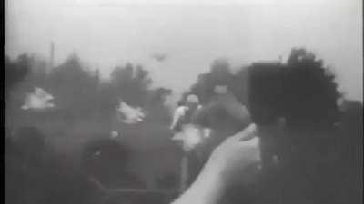 Footage from 1932 showing the wife of Édouard Bénédictus holding up a piece of bulletproof glass made by Édouard while he fires his revolver at the glass.