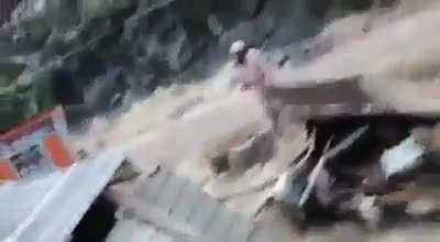 Man Saves the Dog from the flood in the recent flood in Swat, Pakistan.