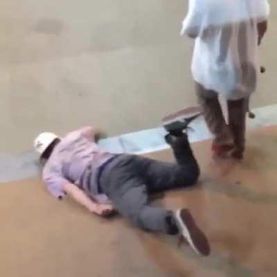 Skater lands on unsuspecting person, completely knocks him unconscious