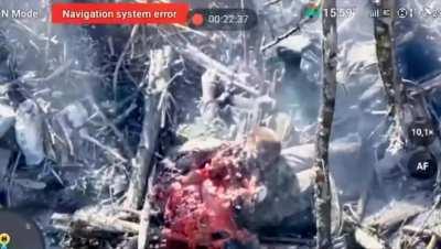 A Russian soldier gets split apart after a drone strike (Graphic)