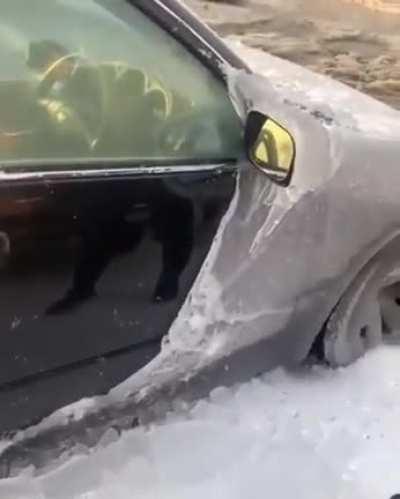 The way this Russian dudes removes the layers of ice from his car.