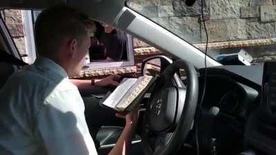 Missionaries sharing scriptures at fast food drive-thru