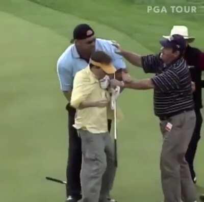 HTDYL pretending to fight with Goldberg while he is golfing