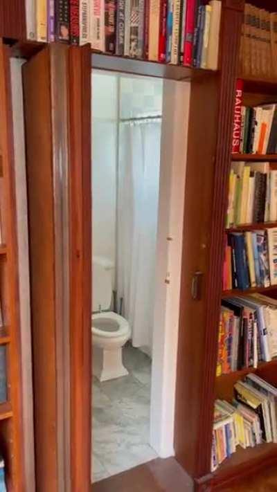 this bathroom hidden inside a home library 📚 @davidchoe