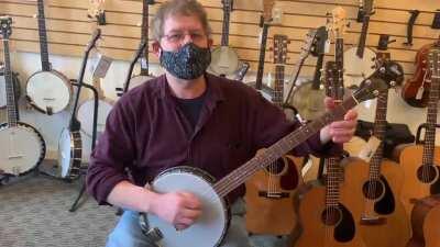 Not quite a guitar but I got a great banjo lesson from this store owner!