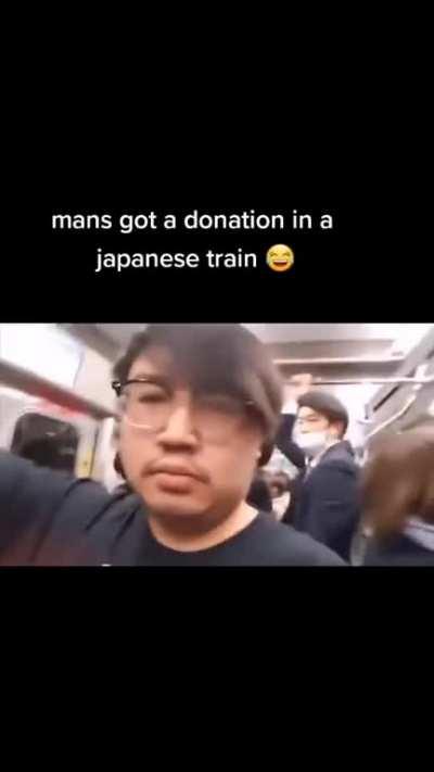 Guy gets donation in Japanese train!