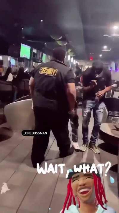 Female security guard picks fight with male security guard, ends up getting dragged across the floor