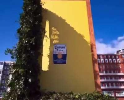 Corona brand effectively used sun rays to create a natural billboard displaying its bottle and label
