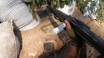 Brazilian volunteers in Serebryansky forest defend their position with an FN FAL and MG3