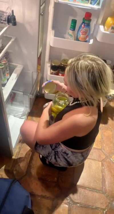 Grabbing a pickle from the fridge