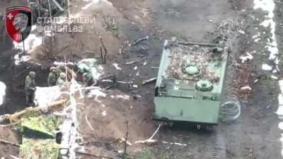 Ukrainian medics of the 63rd Brigade arrive next to a trench in a M113 armored personnel carrier to evacuate four wounded comrades, near Torske, Donetsk Oblast