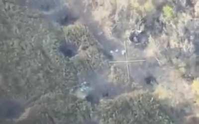 Ukrainian drone captures video of Ukrainian artillery landing just adjacent to Russian armored vehicle with troops on top, in east of Ukraine.