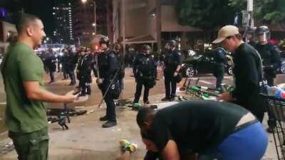 [Los Angeles, CA] In response to celebrations by LA Laker's fans last night, huge numbers of police were deployed in an attempt to clear the crowds. In this clip an LAPD officer pushes a young man to the ground-clearly knocking him unconscious- then ignor