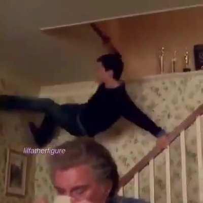 Peter Parker (a.k.a. Spiderman) running down the stairs