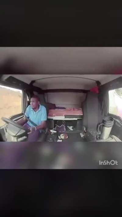 Highway robbers take shots at a moving truck - driver does well to keep it steady!